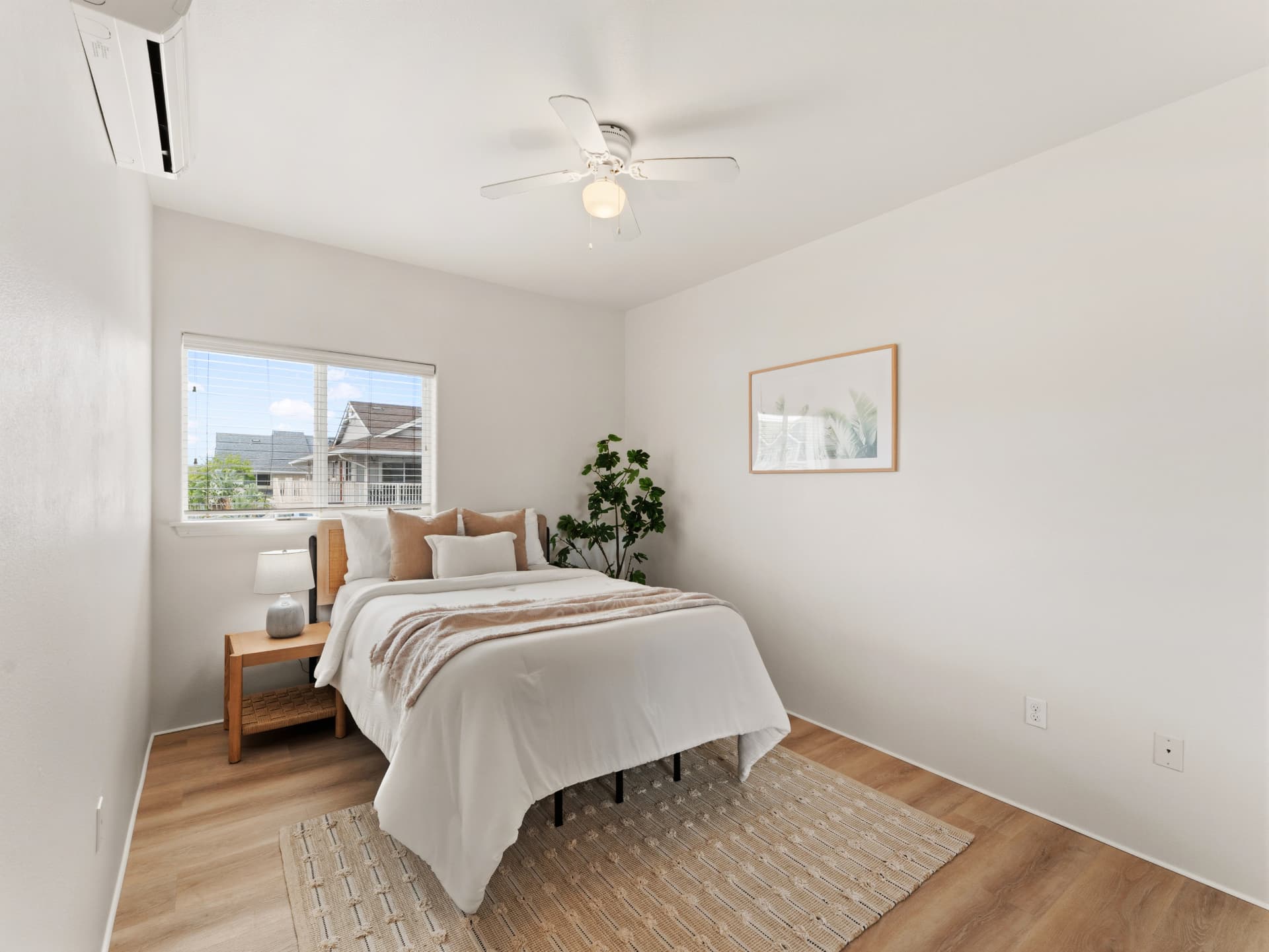 Second bedroom with ceiling fan, split A/C and new flooring