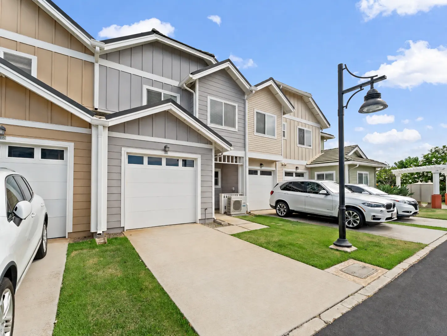 Side street view of the townhomes and sidewalk