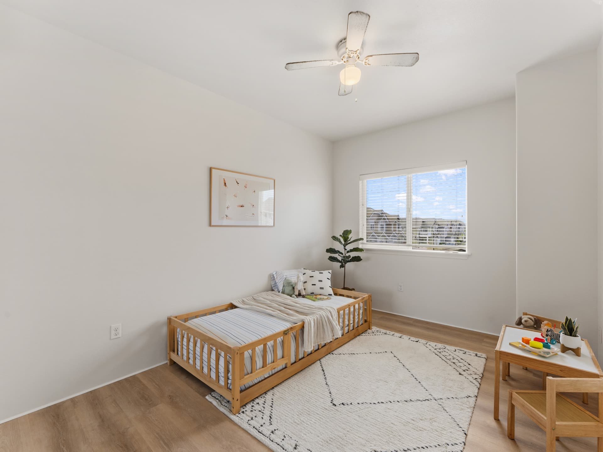 Third bedroom set up as a kids room with play area