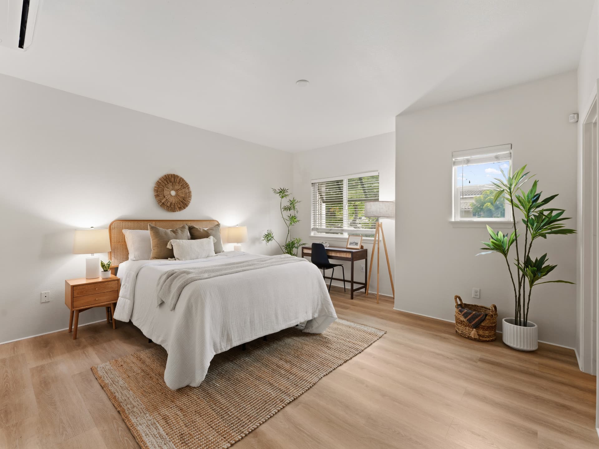 Primary bedroom with new LVP flooring, split A/C and desk nook