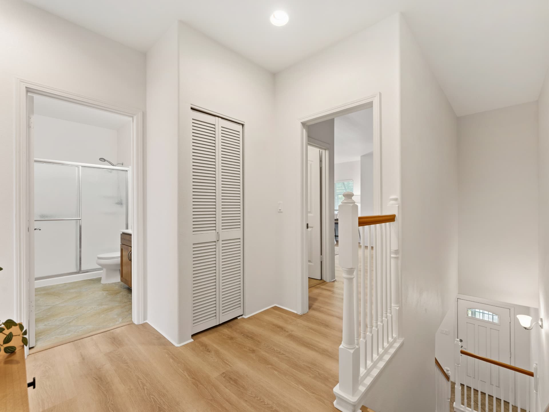 Upstairs landing with new luxury vinyl plank flooring and full bath