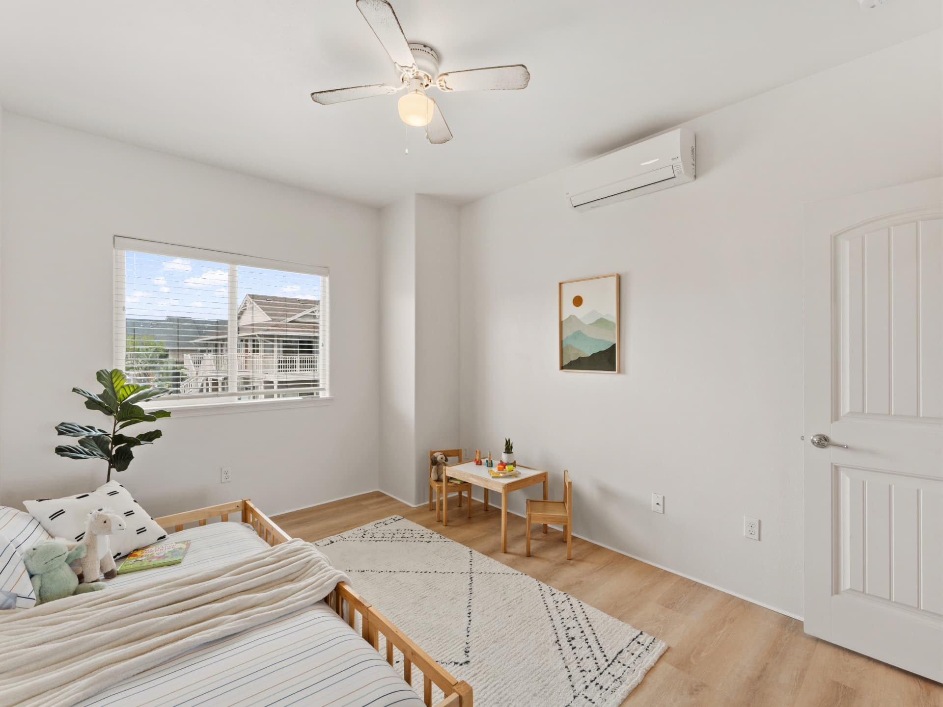 Kids bedroom with play table, ceiling fan and split A/C