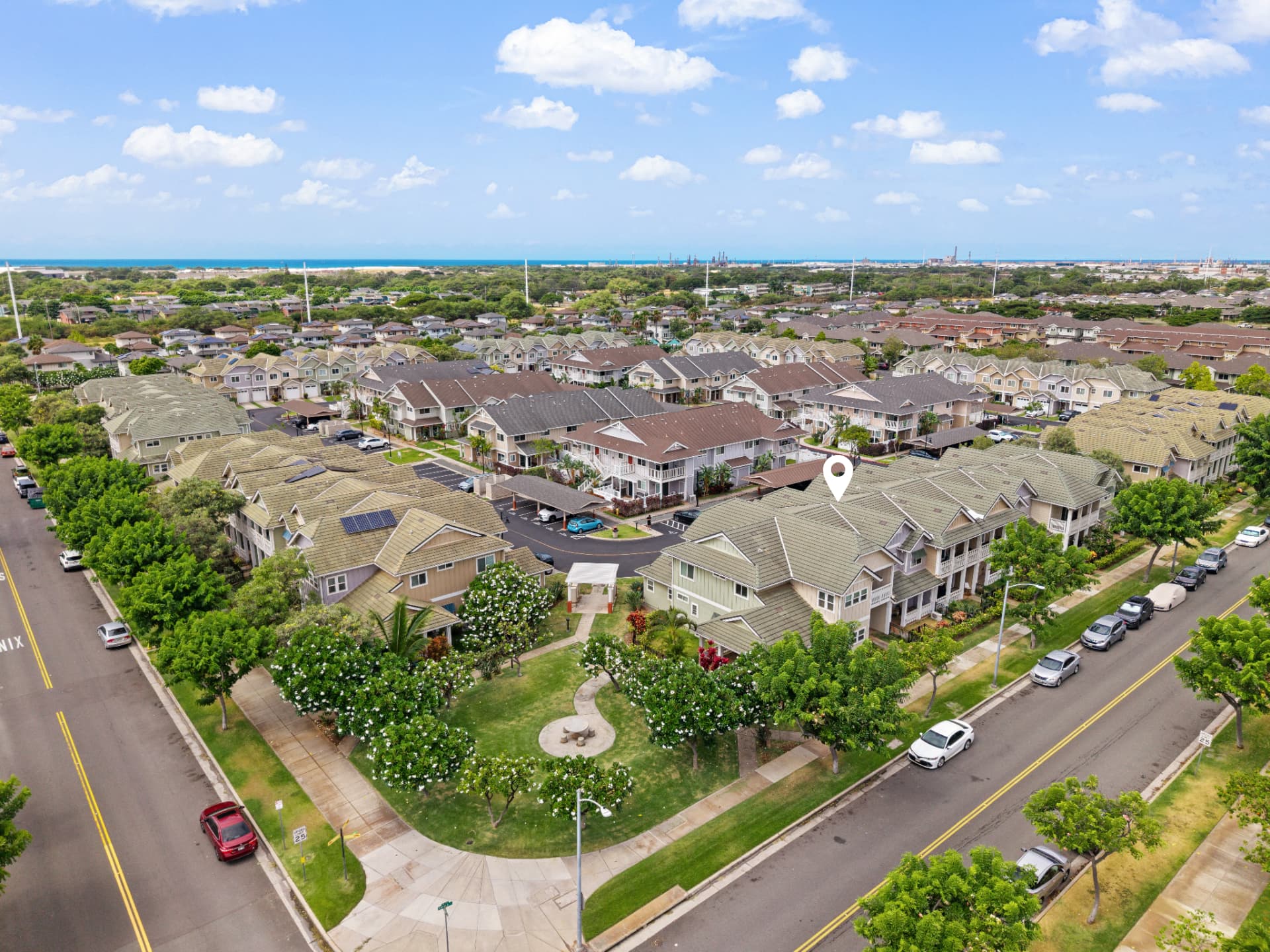Aerial view of Pulewa at Mehana showing the unit location, park green space and ocean beyond