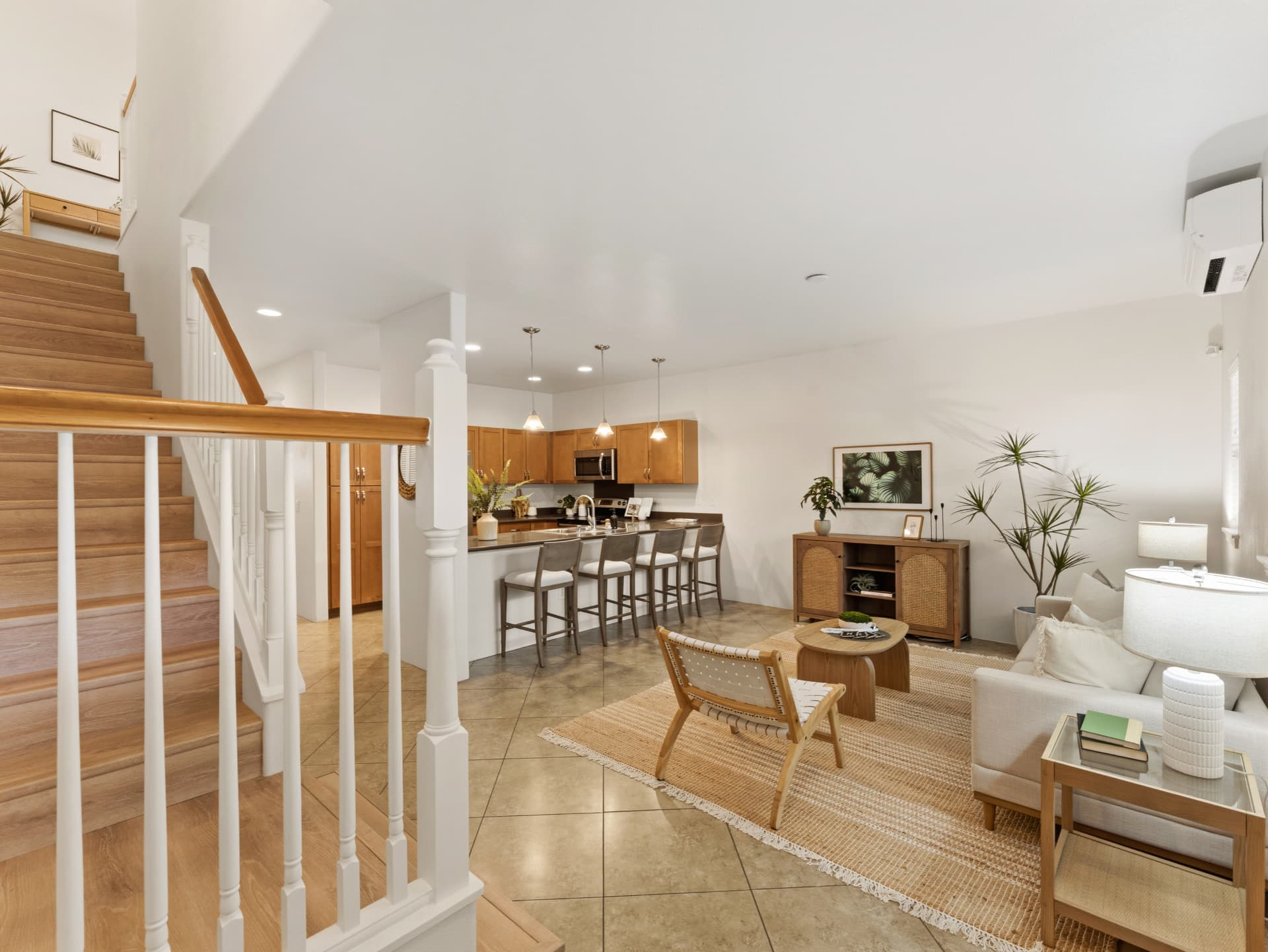 Staircase view toward the kitchen and living area