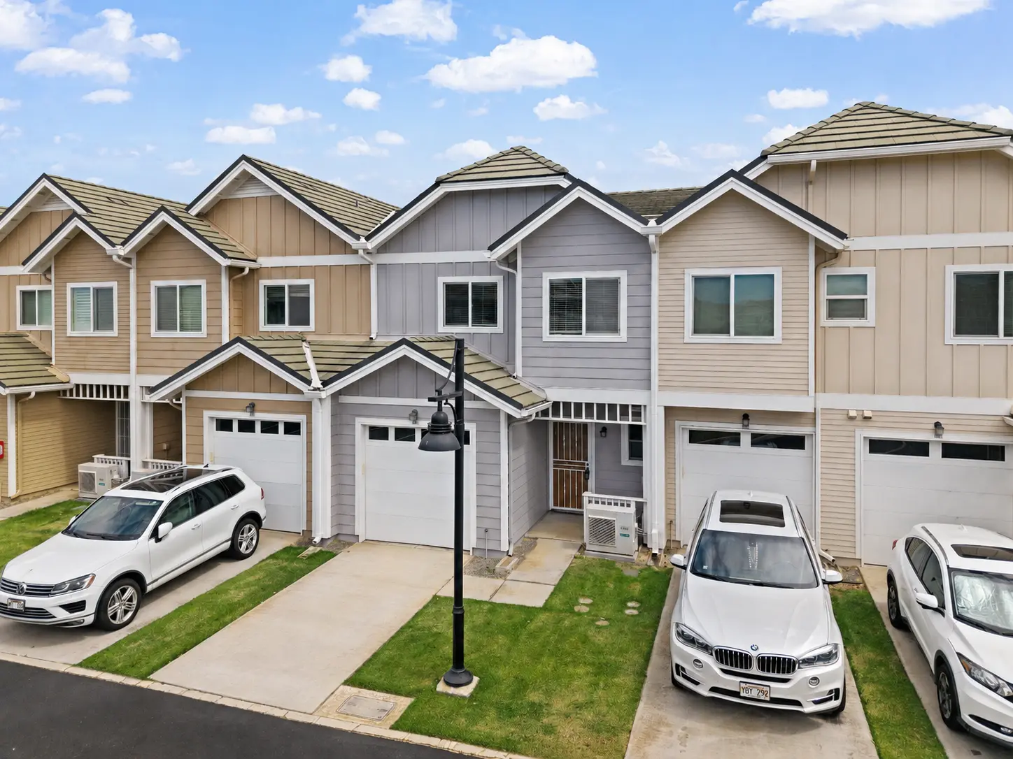Front elevation of the townhome with two parking spaces