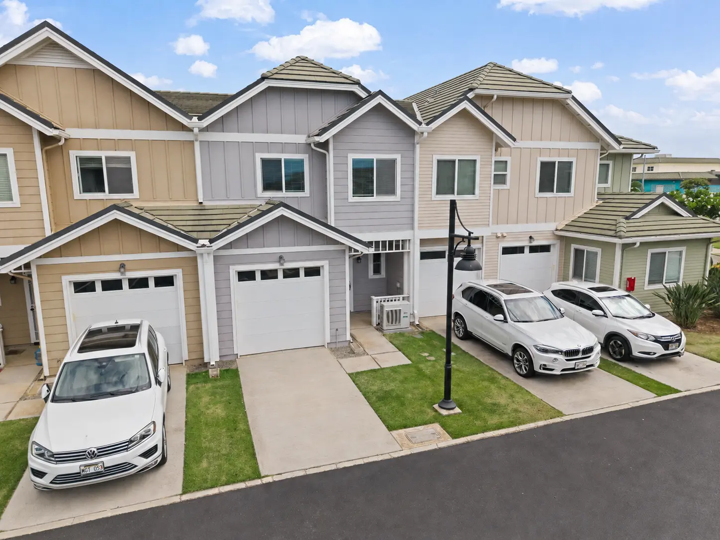 Aerial view of the townhome and driveway parking